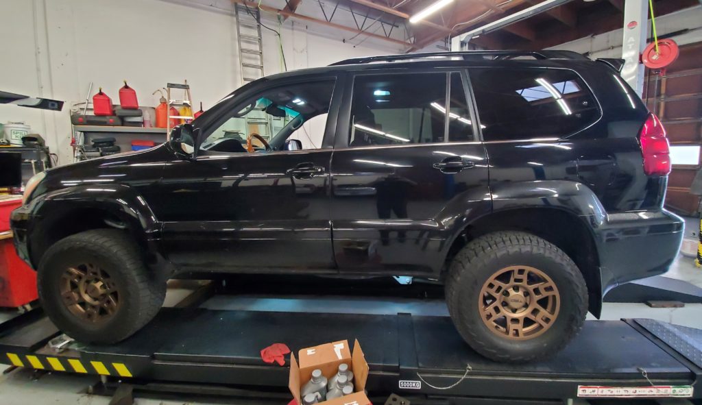 a black Lexus GX 470 outfitted with bronze Toyota TRD-style wheels paired with Falken Wildpeak all-terrain tires