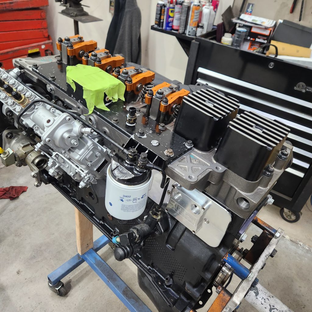 a fully assembled, high-performance engine block being prepped for installation at J&S Automotive