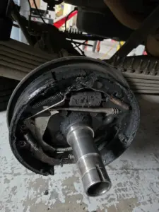 rear drum brake assembly with significant contamination