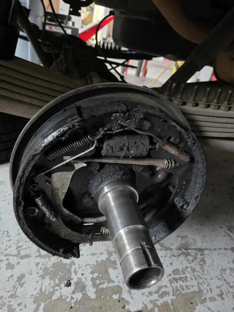 rear drum brake assembly with significant contamination
